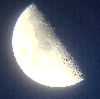 Moon through a 60mm telescope using a mobile phone camera